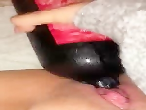 Ice cold bottle in her tight pussy